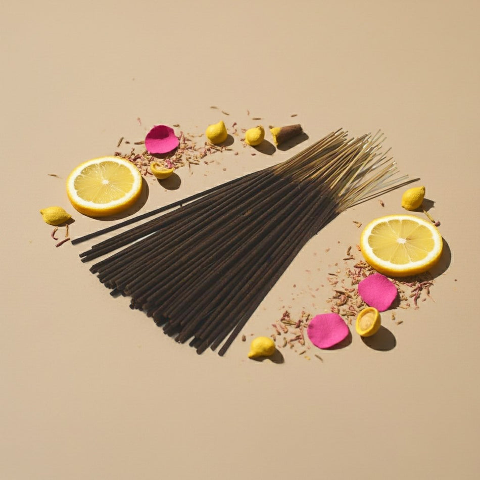 Pink Lemonade Incense Sticks with lemon slices and flowers on a beige background