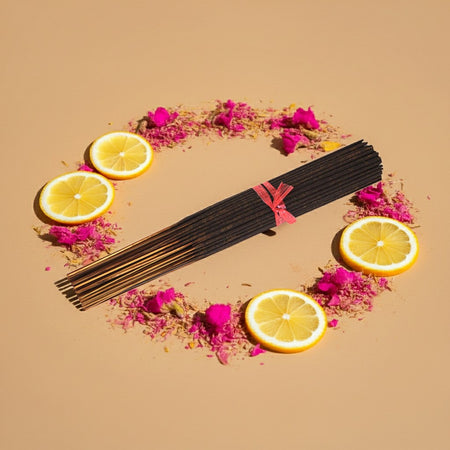 Pink Lemonade Incense Sticks with lemon slices and pink flowers on a beige background