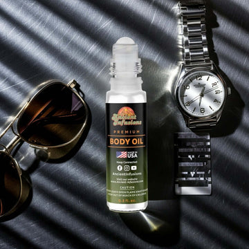 Prada Luna Rossa Sport Inspired Body Oil with sunglasses and wristwatch in background