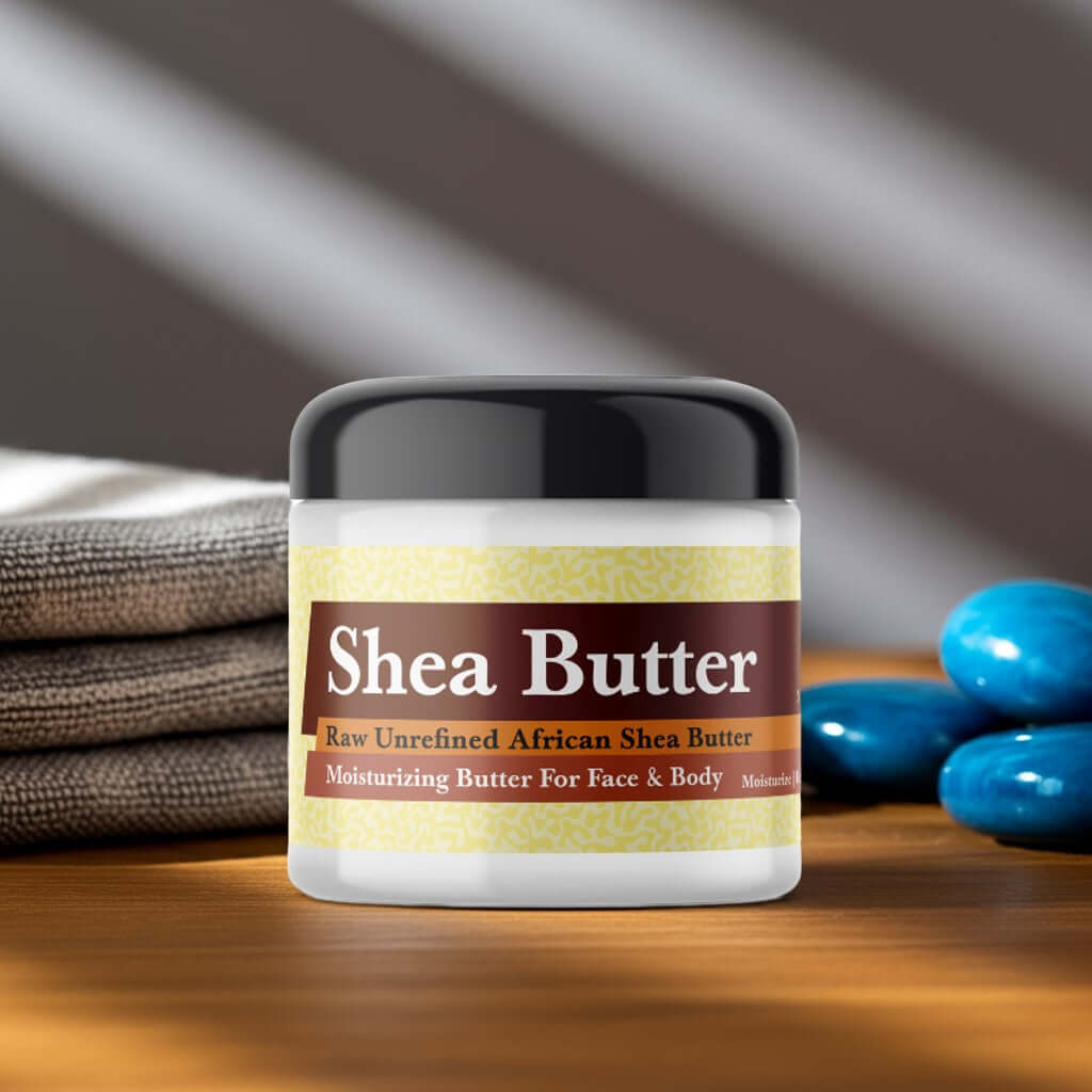 Amber Blue Scented Shea Butter jar, moisturizing skincare product for face and body, next to blue stones and towels.