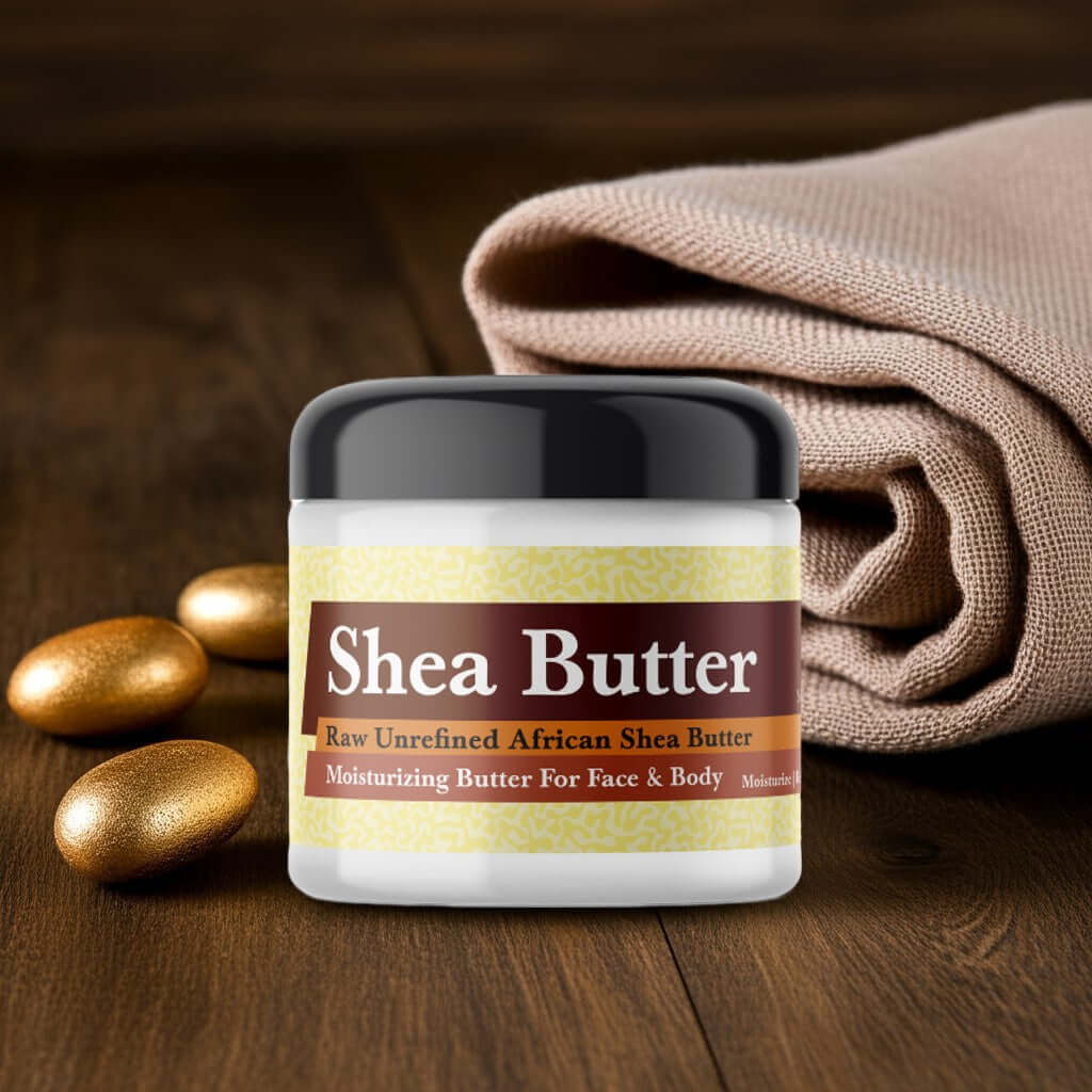 Jar of Amber Gold Scented Shea Butter on wooden table with cloth and gold stones.