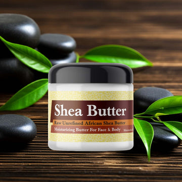 Giorgio Armani Armani Code Inspired Scented Shea Butter jar on wooden surface with green leaves and stones