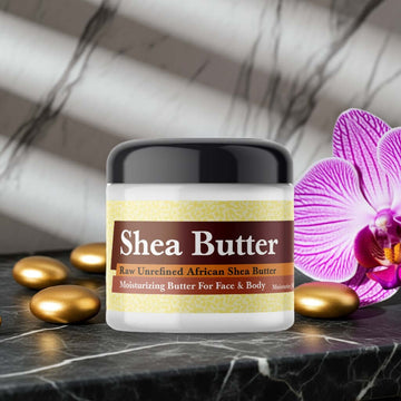 Bond No 9 New York Nights Inspired Scented Shea Butter on marble with orchid