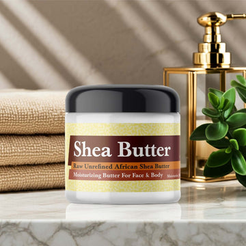 Golden Sand Scented Shea Butter jar on a marble countertop.