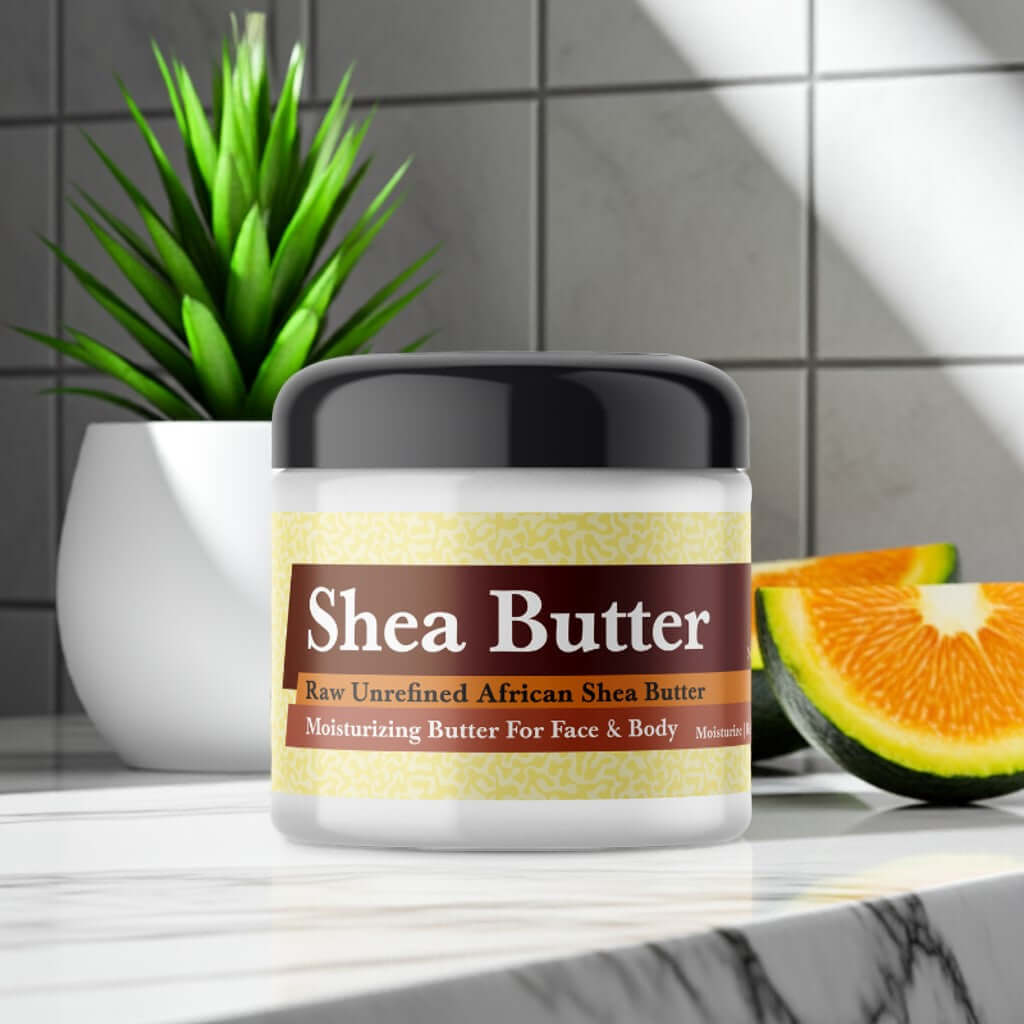 Jamaican Fruit Scented Shea Butter in a jar on a bathroom counter with a sliced fruit and green plant in the background.
