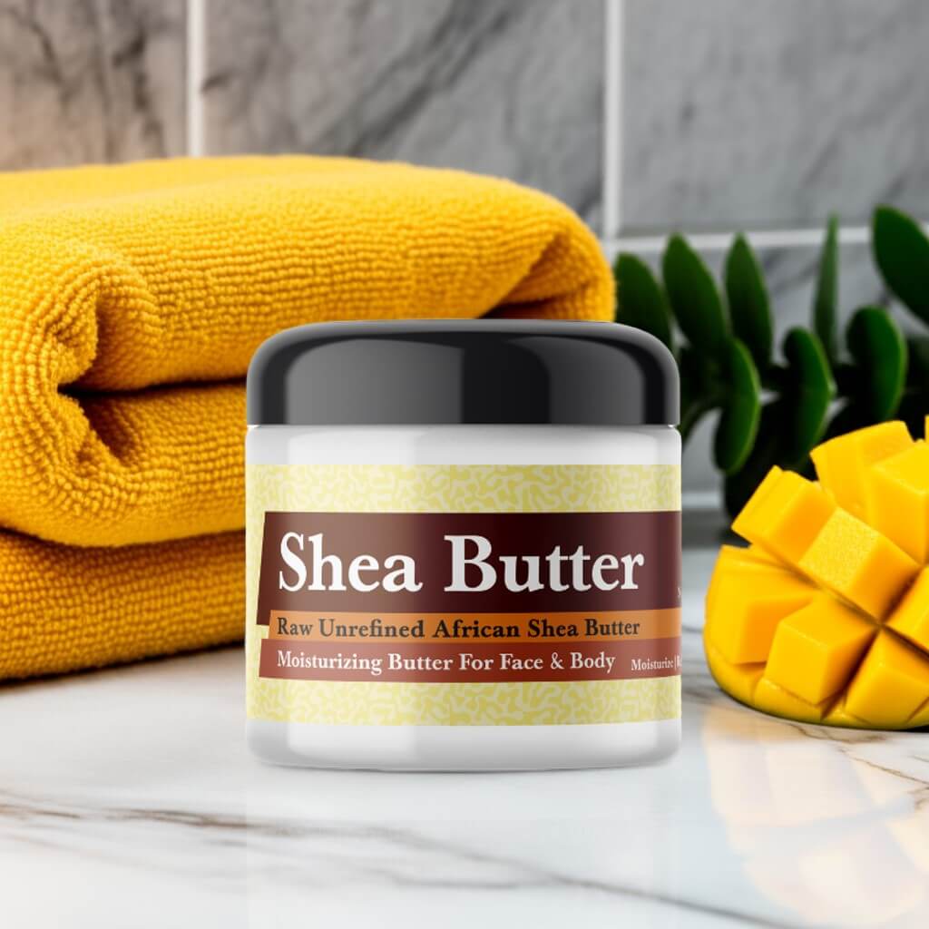 Mango Butter Scented Shea Butter jar next to a yellow towel and sliced mango, perfect for moisturizing face and body.