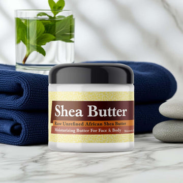 Polo Sport Inspired Scented Shea Butter in a jar, with a luxurious spa setting featuring folded towels and fresh greenery for relaxation.