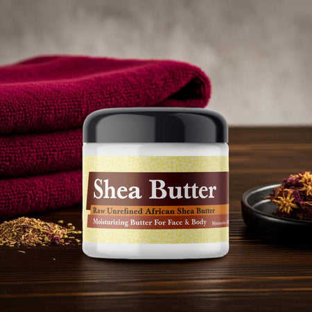 Sabatt Scented Shea Butter jar on a wooden table with red towel and floral decor.