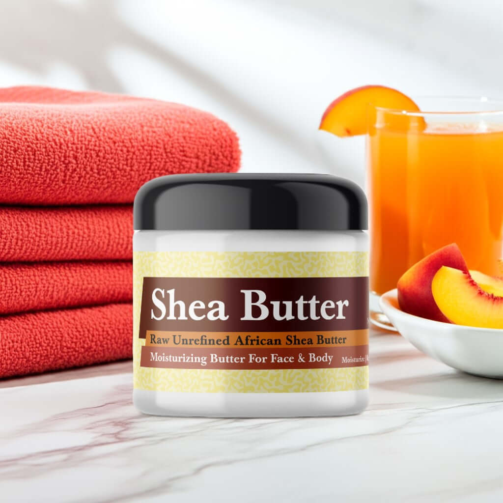 Sex on the Beach Scented Shea Butter jar beside orange cocktails and towels on marble surface