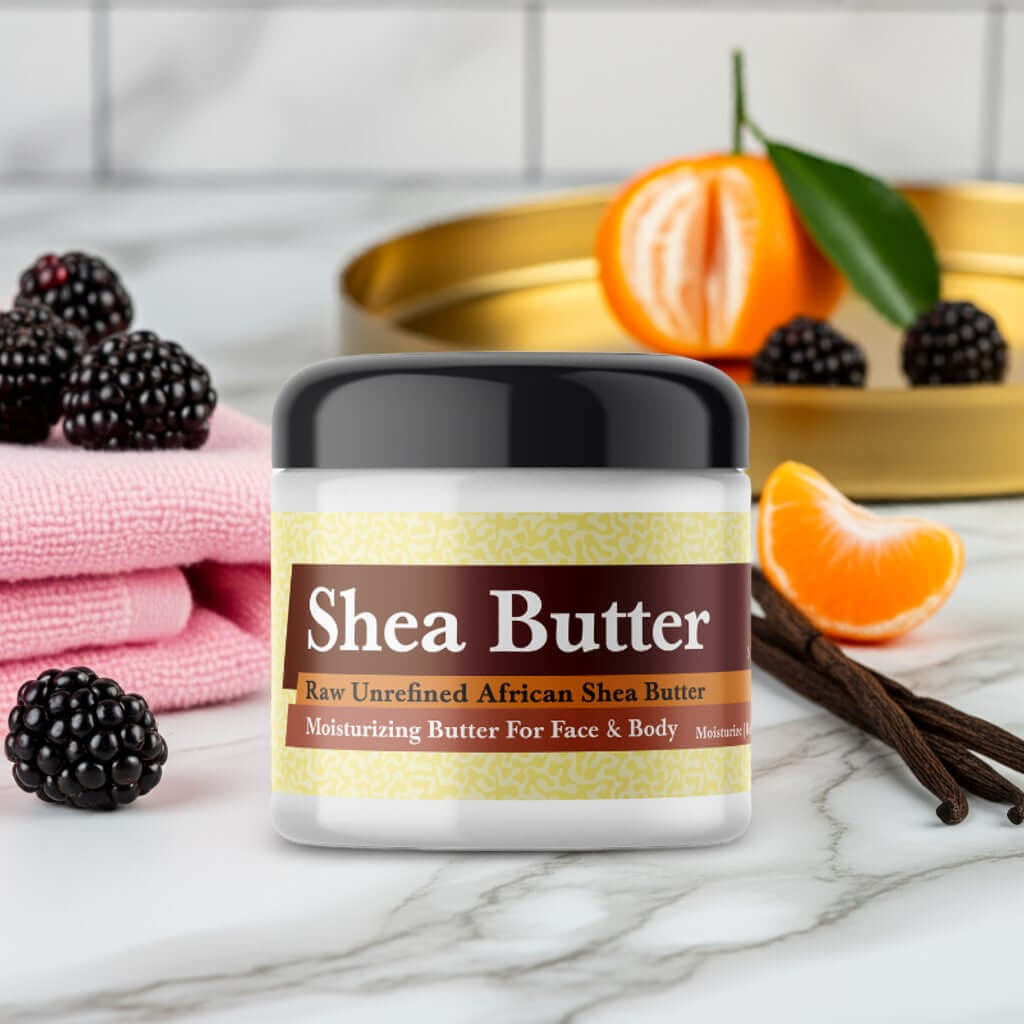 Jar of Juicy Couture Viva La Juicy Inspired Scented Shea Butter with blackberries and citrus on marble surface.