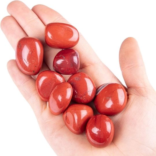 Genuine Red Jasper tumbled stones showcasing their vibrant hues, healing properties, and spiritual meaning.