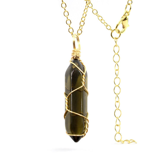 Close-up of a Smoky Quartz Necklace featuring a translucent gemstone wrapped in handcrafted gold wire with a stainless steel chain.