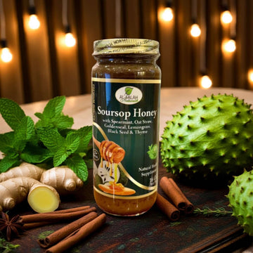 Jar of Soursop Herbal Honey surrounded by ingredients like cinnamon, ginger, and soursop fruits, ideal for organic infusion lovers.