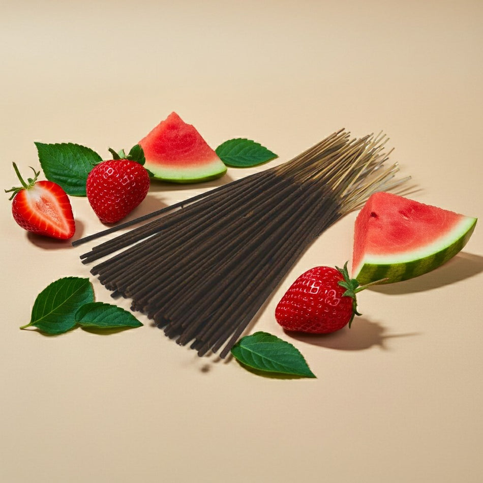 Strawberry Watermelon Incense Sticks in the center of a beige background with watermelon and strawberries