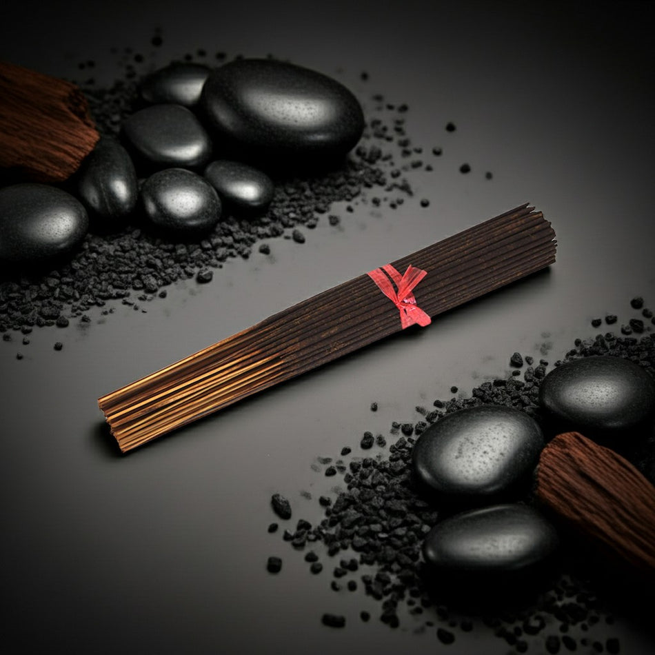 Very Sexy Incense Sticks on a grey background with rocks around