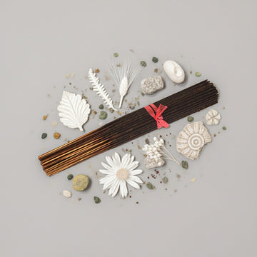 A clean, bright display of White Linen Incense Sticks by Ancient Infusions, showcasing the fresh, powdery fragrance and hand-dipped craftsmanship.
